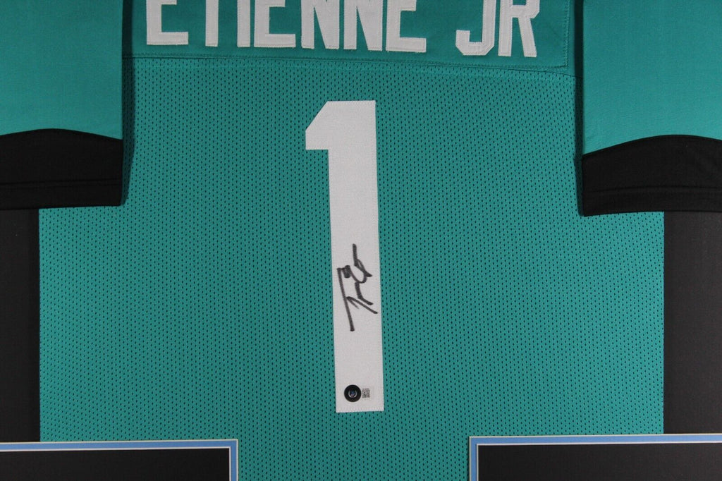 TRAVIS ETIENNE (Jaguars teal TOWER) Signed Autographed Framed Jersey B ...