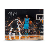 Kemba Walker Autographed Kemba Walker vs. Stephen Curry Photo