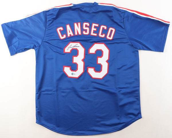 Jose Canseco Signed Texas Rangers Blue Jersey (Beckett) 2xWorld Series Champion