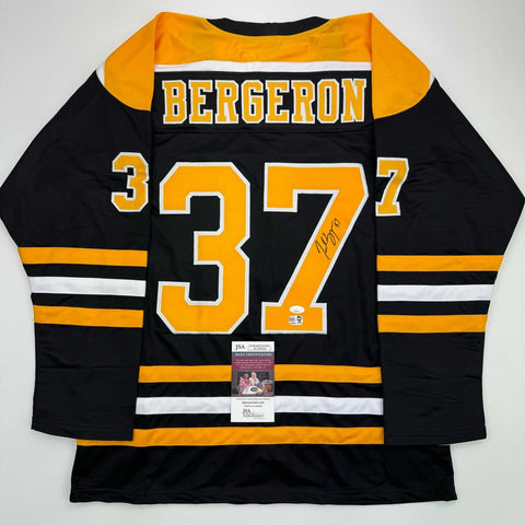 Autographed/Signed Patrice Bergeron Boston Black Hockey Jersey PSA/DNA COA