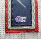 NEW ENGLAND PATRIOTS MAC JONES AUTOGRAPHED FRAMED WHITE JERSEY BECKETT QR 202404