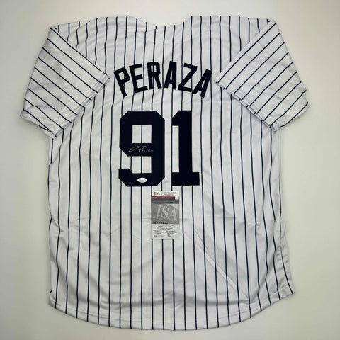 Autographed/Signed Oswald Peraza New York Pinstripe Baseball Jersey JSA COA
