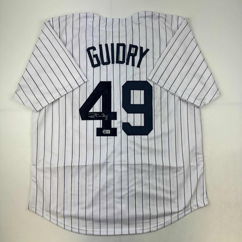 Autographed/Signed Ron Guidry New York Pinstripe Baseball Jersey Beckett BAS COA