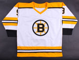 Johnny Bucyk Signed Bruins White Home Jersey Inscribed "H.O.F. 1981" (JSA COA)