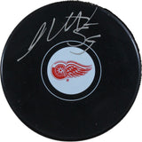 Moritz Seider Autographed/Signed Detroit Red Wings Logo Puck Fanatics 53841