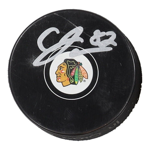 Caleb Jones Signed Chicago Blackhawks Logo Hockey Puck (JSA COA)