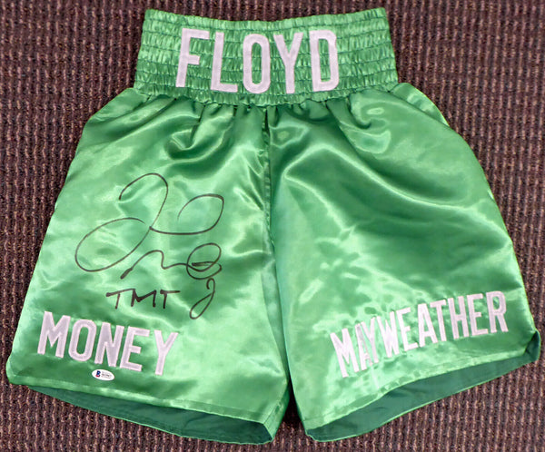 FLOYD MAYWEATHER JR. AUTOGRAPHED GREEN BOXING TRUNKS "TMT" BECKETT BAS 159663