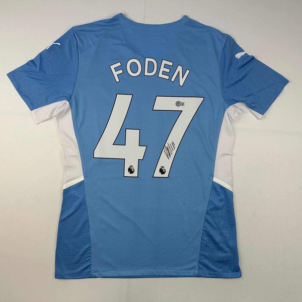 Autographed/Signed Phil Foden Manchester City Blue Soccer Jersey Beckett BAS COA