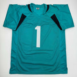 Autographed/Signed Travis Etienne Jr. Jacksonville Teal Jersey Beckett BAS COA