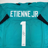 Autographed/Signed Travis Etienne Jr. Jacksonville Teal Jersey Beckett BAS COA
