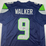 Autographed/Signed Kenneth Walker Seattle Blue Football Jersey Beckett BAS COA