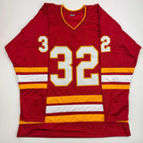 Autographed/Signed Dustin Wolf Calgary Red Hockey Jersey Beckett BAS COA