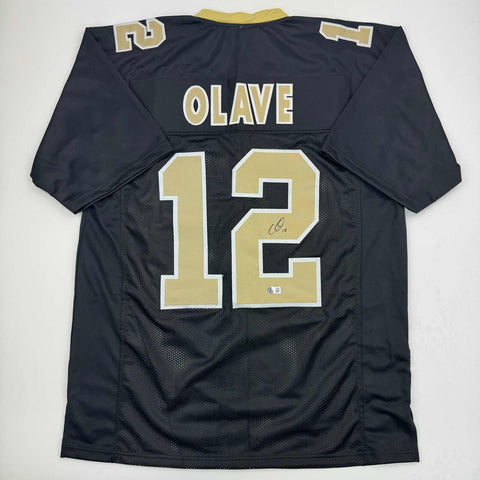 Autographed/Signed Chris Olave New Orleans Black Football Jersey Beckett BAS COA