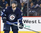 Josh Morrissey Signed Jets Jersey (Beckett COA) Playing career 2013-present