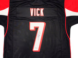 ATLANTA FALCONS MICHAEL VICK AUTOGRAPHED BLACK JERSEY BECKETT BAS WITNESS 230182
