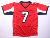 Michael Vick Signed Atlanta Falcons Red Jersey (JSA COA) 4xPro Bowl Quarterback