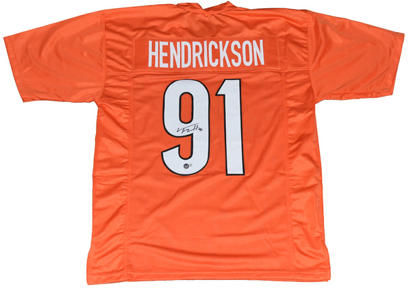 TREY HENDRICKSON AUTOGRAPHED CINCINNATI BENGALS #91 ORANGE JERSEY BECKETT