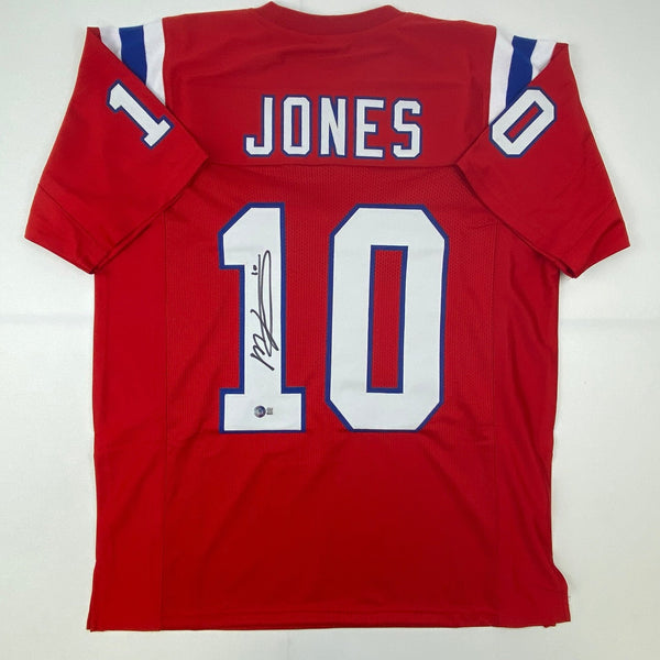 Autographed/Signed Mac Jones New England Red Jersey Beckett BAS COA