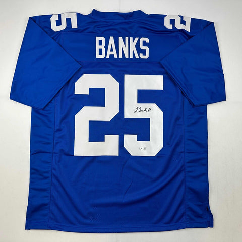 Autographed/Signed Deonte Banks New York Blue Football Jersey Beckett BAS COA