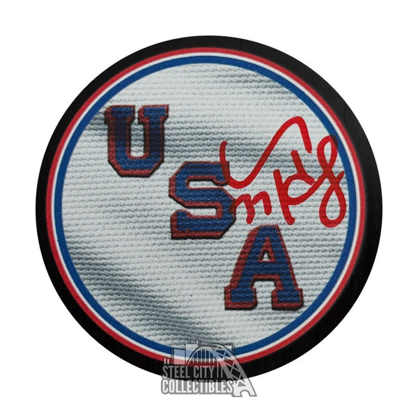 Connor Hellebuyck Autographed Team USA 2026 Olympics Hockey Puck - Fanatics