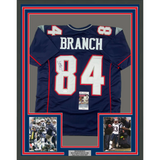 Framed Autographed/Signed Deion Branch 33x42 New England Blue Jersey JSA COA