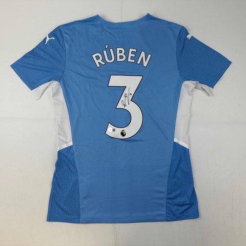Autographed/Signed Ruben Dias Manchester City Blue Soccer Jersey Beckett BAS COA