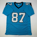 Autographed/Signed Muhsin Muhammad Carolina Blue Football Jersey Beckett BAS COA