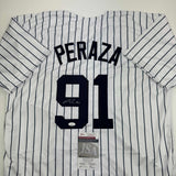Autographed/Signed Oswald Peraza New York Pinstripe Baseball Jersey JSA COA