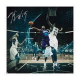 Kemba Walker Autographed Attacking the Wolves Photo