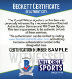 RUSSELL WILSON AUTOGRAPHED SPORTS ILLUSTRATED SEAHAWKS IN BLUE BECKETT 182297