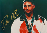Dan O'Brien Autographed 8x10 With Medal Photo- TriStar Authenticated