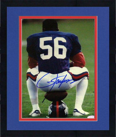 Framed Lawrence Taylor Sitting on Football and Helmet Vertical 8x10 Photo